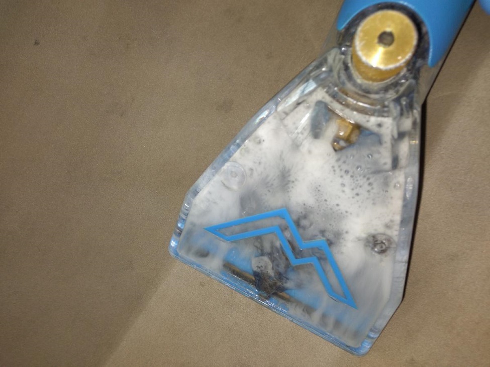 Cleaning a couch in Belltown Neighborhood of Stamford.